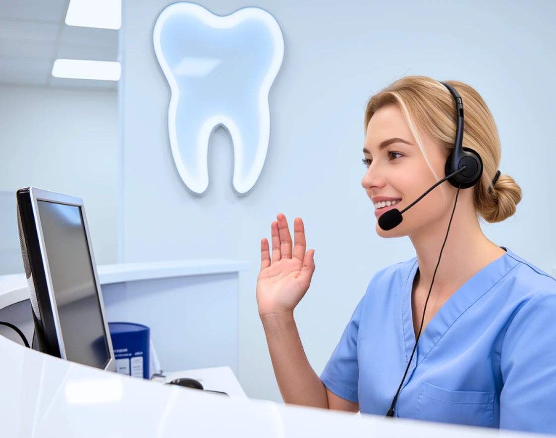 Dental receptionist with a headset answering a new patient call